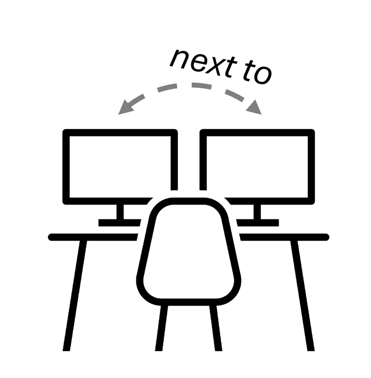 Two monitors next to each other on a desk.